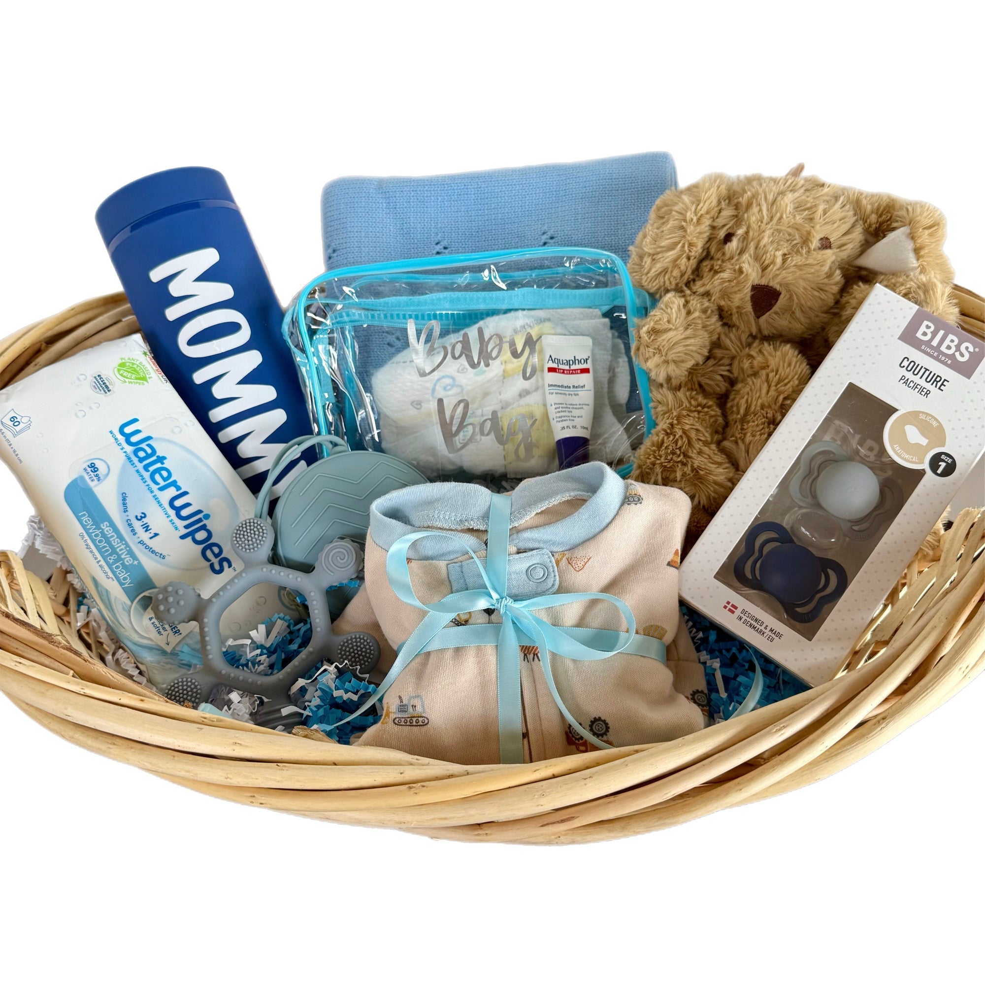 Baby gift basket with items including a teddy bear, baby booties, and diapers on a white background.